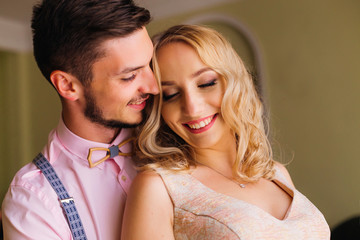 Close-up of a young couple who cute smile and embracing each other