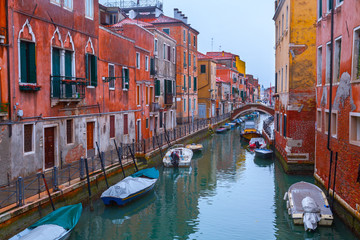 Wintertime of the rainy weather. Emerald water in the canals at low tide. Less known are not tourist destinations in the Castello-Arsenale. Venice. Italy.