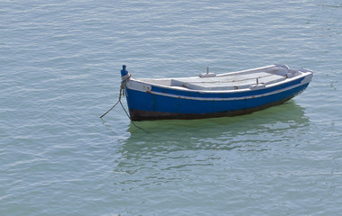 Naklejka na ściany i meble small boat in the sea