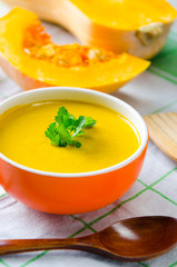 Pumpkin soup served on the table in bowl