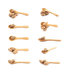Wooden spoon and pecan nut composition