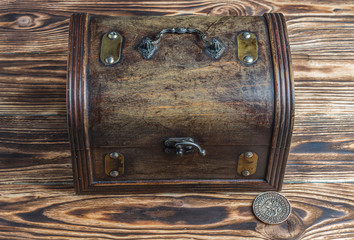Open treasure chest with gold coins 