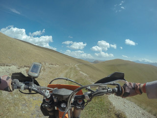 Enduro journey with dirt bike high in the mountains