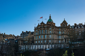 Scottish Saltire and British Union Jack flags on a top of a building of Lloyds Banking Group  in Edinburgh Scotland