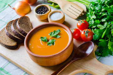 Pumpkin soup served on the table in bowl