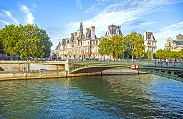 Obraz na płótnie Canvas Paris, France - August 28, 2014: View of the Hotel de Ville in Paris, the city administration building, across the Seine River