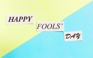 Happy Fools Day printed phrase on green blue background