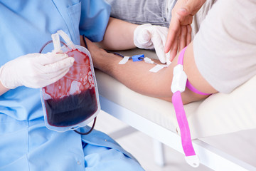 Patient getting blood transfusion in hospital clinic