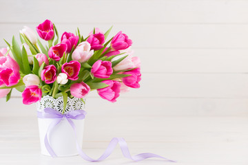 Pink tulip on the white background. Easter background