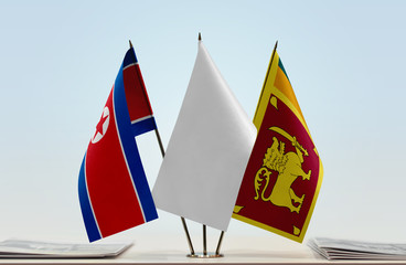 Flags of North Korea and Sri Lanka with a white flag in the middle