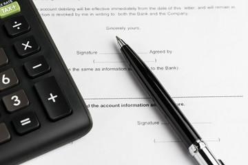 Financial money loan, mortgage or buy and sell contract with bank, printed paper form with pen to sign and calculator