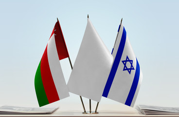 Flags of Oman and Israel with a white flag in the middle