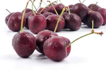 Sweet red cherries isolated on a white background.