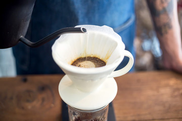 Barista hands to make art coffee