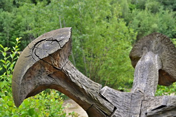 Art in nature - wooden mushroom in front of green