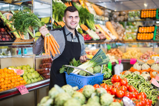 Male seller helping to choose