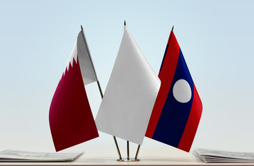 Flags of Qatar and Laos with a white flag in the middle