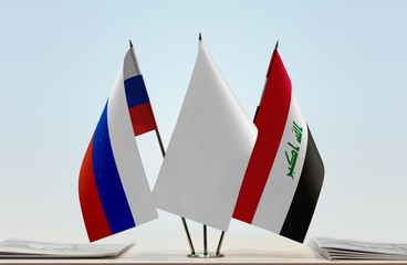 Flags of Russian Federation and Iraq with a white flag in the middle