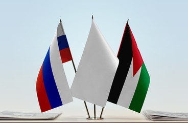Flags of Russian Federation and Jordan with a white flag in the middle