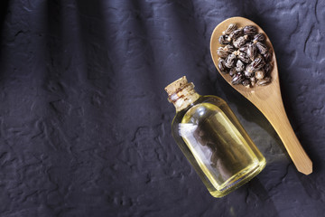 beans and castor oil on the black table