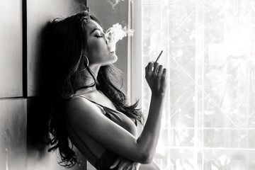 Fashion portrait of  beautiful woman sexy slim body smoking cigarette © Art_Photo