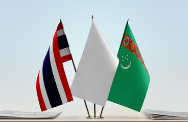 Flags of Thailand and Turkmenistan with a white flag in the middle
