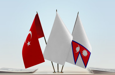 Flags of Turkey and Nepal with a white flag in the middle