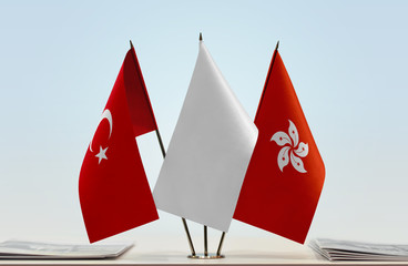Flags of Turkey and Hong Kong with a white flag in the middle