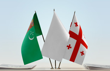 Obraz na płótnie Canvas Flags of Turkmenistan and Georgia with a white flag in the middle