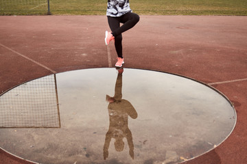 one person exercise, sport clothes, tights, puddle reflection in water, Single-Leg Squat