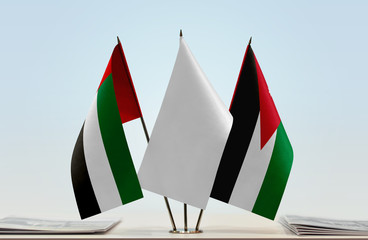 Flags of UAE and Jordan with a white flag in the middle
