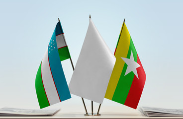 Flags of Uzbekistan and Myanmar with a white flag in the middle