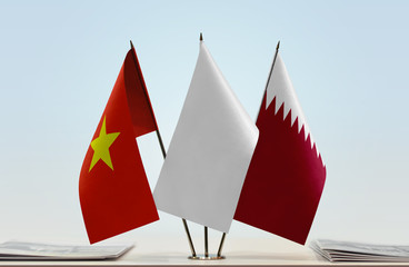 Flags of Vietnam and Qatar with a white flag in the middle
