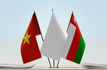 Flags of Vietnam and Oman with a white flag in the middle