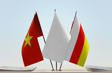 Flags of Vietnam and South Ossetia with a white flag in the middle