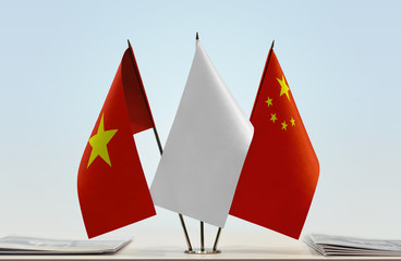 Flags of Vietnam and China with a white flag in the middle