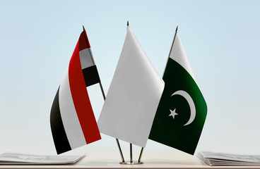 Flags of Yemen and Pakistan with a white flag in the middle