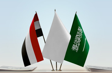 Flags of Yemen and Saudi Arabia with a white flag in the middle