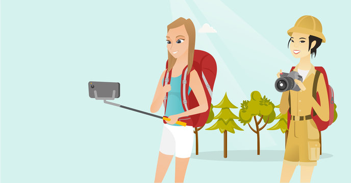 Young multiethnic happy female travelers making selfie. Smiling caucasian white and asian women with backpacks taking selfie photo with a mobile phone. Vector cartoon illustration. Horizontal layout.