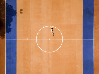 drone view of a man in a football court