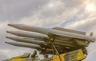 rocket set against a dramatic sky. four missiles ready for launch. Weapons of mass destruction,...