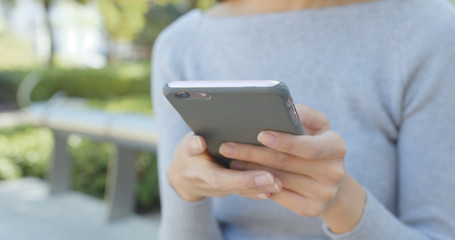 Using smart phone in the park