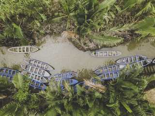 Drone view of a small river with wood boats
