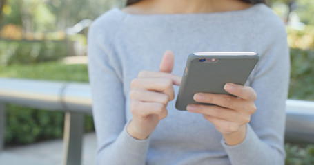 Woman use of mobile phone at outdoor