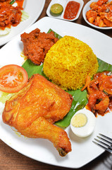 Biryani rice  with fried chicken drumstick and egg    