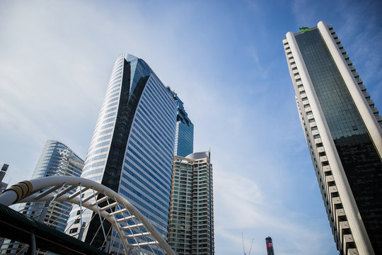 Image of skyscrapers with the bridge and sky.