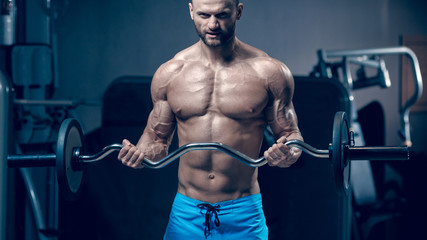 Fototapeta na wymiar Muscular man with barbell