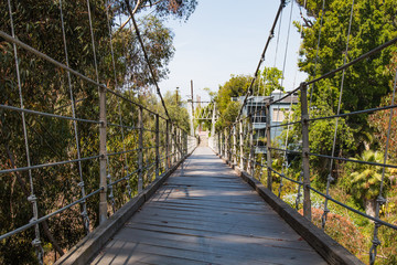Low angle of the 375 feet long Spruce Street Suspension Bridge in San Diego, California. 