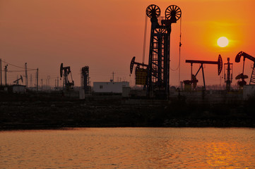 Drilling rig at sunset