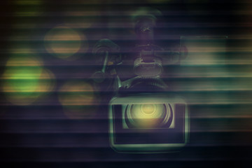 professional video camcorder in studio with blurred dark background